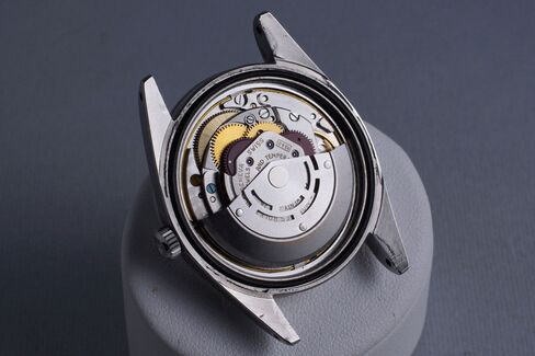 You have to remove both a screw-down caseback and an anti-magnetic cover to get to the automatic movement.