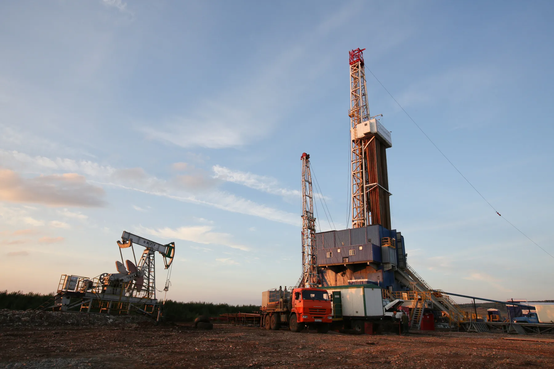 An oil drilling platform and a&nbsp;pumping jack at a drilling site near Almetyevsk, Russia