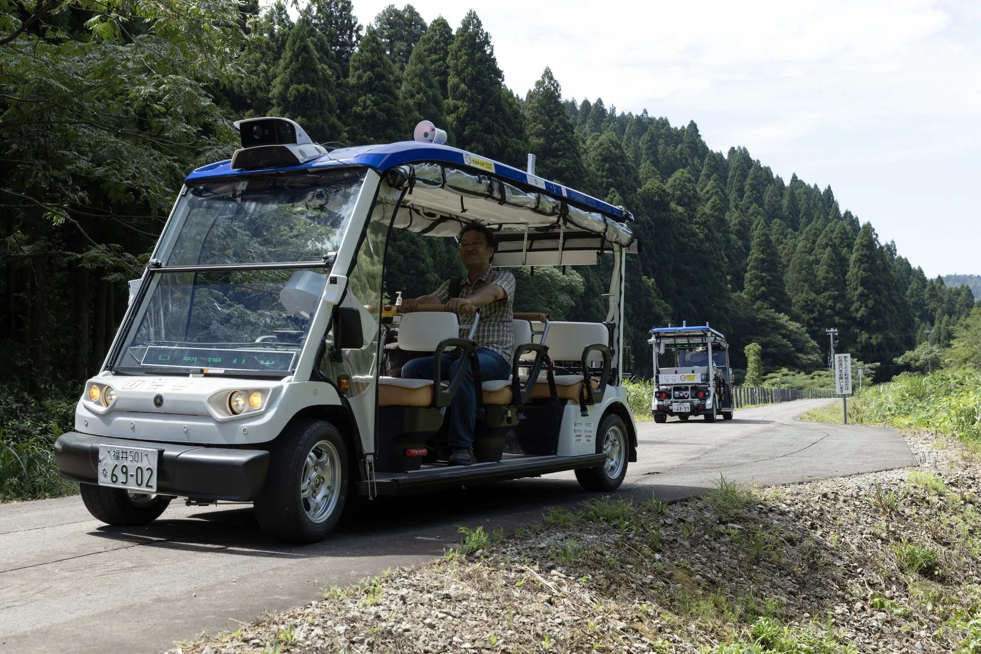 A passenger aboard a self-driving vehicle with level-4 capabilities in Fukui, Japan.