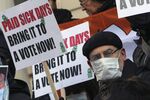 Activists rallied in 2013 for paid sick leave in New York City. The city passed a 2014 law. 