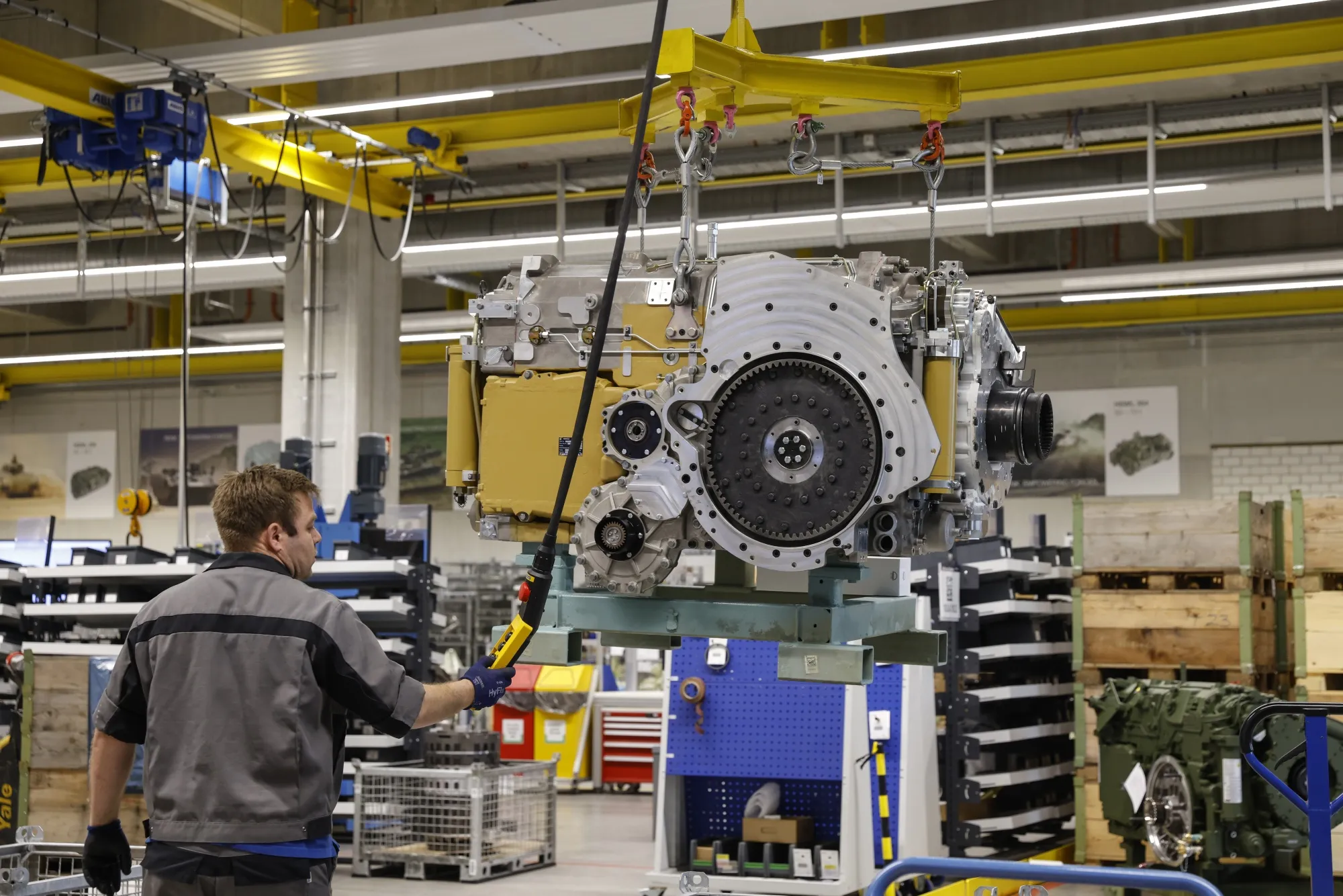 An works on a section of a Leopard 2 tank gear transmission in Augsburg.
