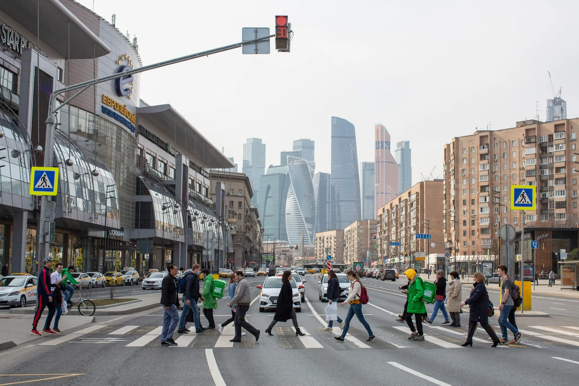 Pedestrians cross a street in Moscow, on April 15.