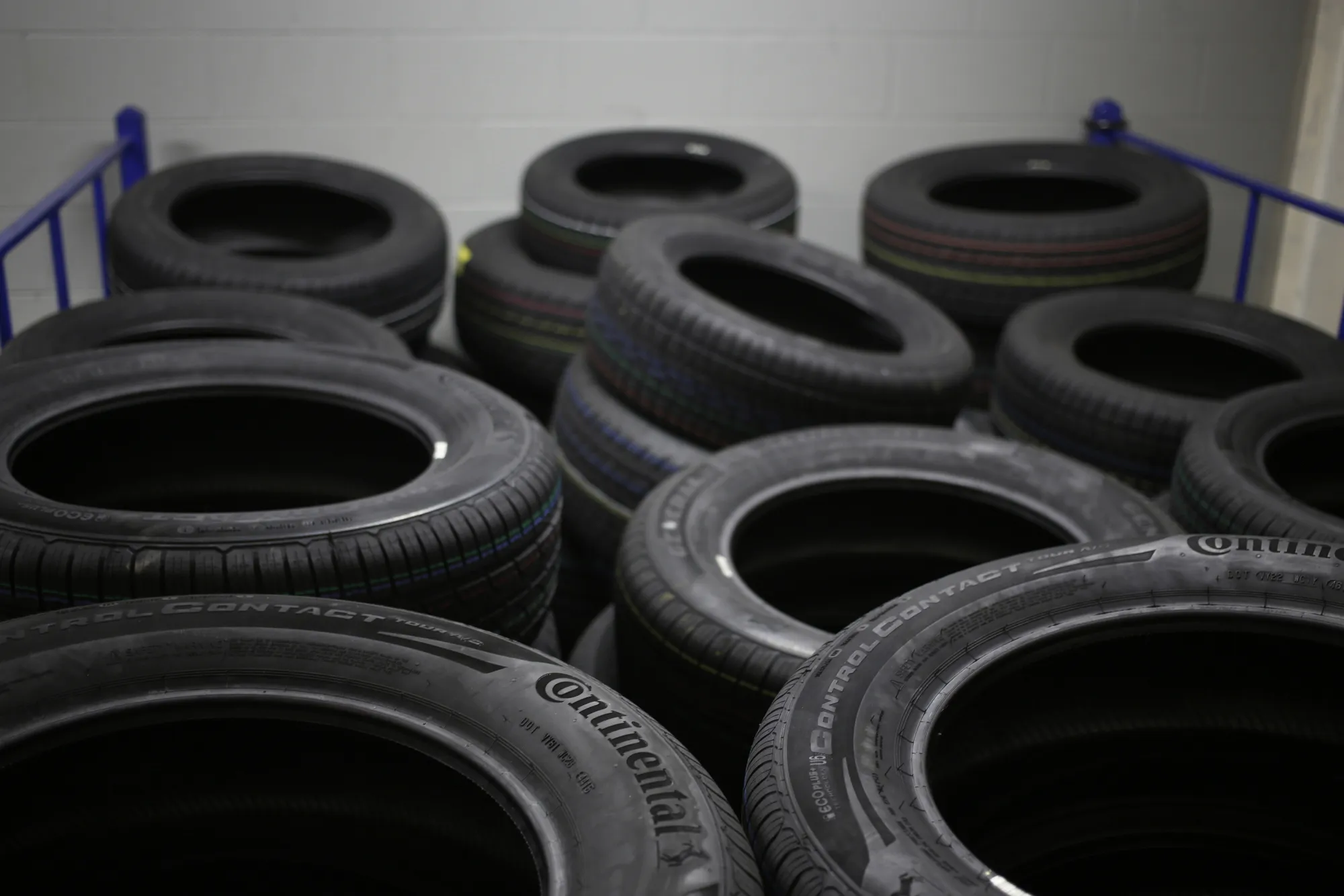 Automotive tires sit in stacks at the Continental Tire Sumter plant distribution warehouse in Sumter, South Carolina, U.S., on Thursday, Dec. 17, 2015. The lowest U.S. rubber prices since 2009 have helped tiremakers expand profit margins and provide a strong outlook for 2016 as North American demand for auto parts continues to climb toward pre-recession levels, according to reports by Bloomberg Industries.