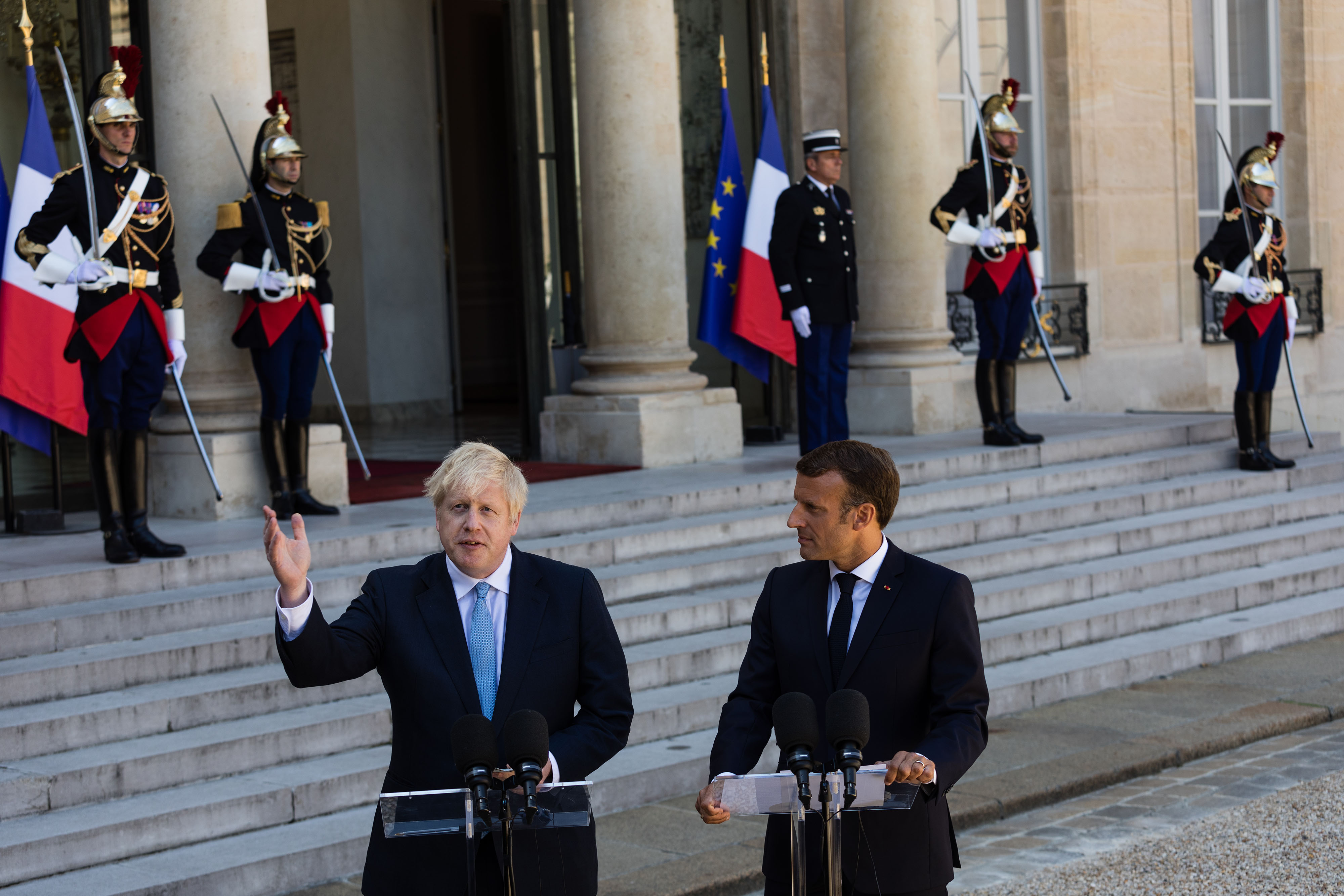 Macron Pours Cold Water On Johnson S Optimism Over Brexit Deal Bloomberg