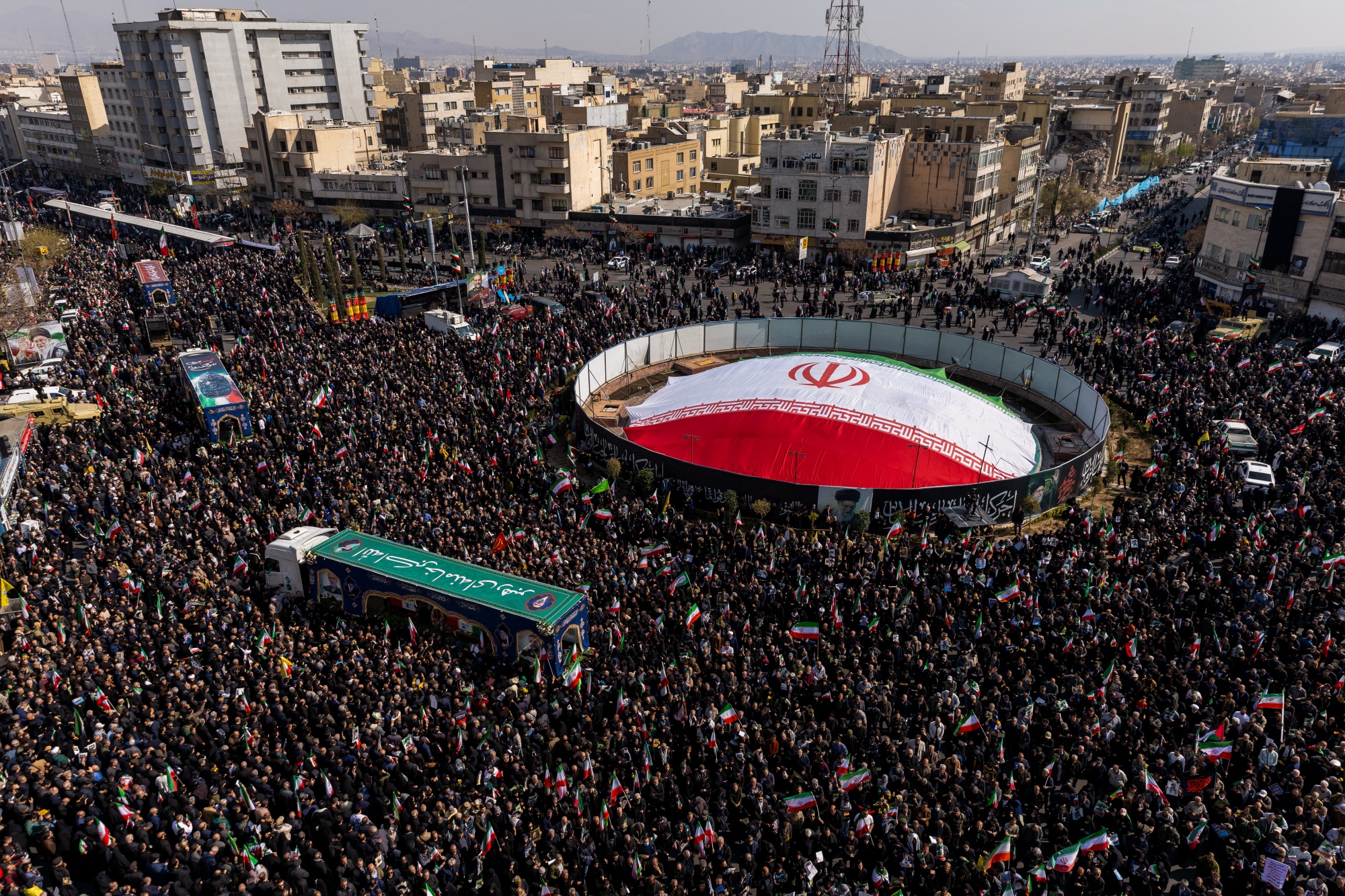 TEHRAN, IRAN - MARCH 18: Large crowds gather during a joint funeral held for Ali Larijani, Secretary of Iran's Supreme National Security Council, Basij commander Major General Gholam Soleimani, and 84 sailors from the Iranian Navy frigate IRIS Dena, on March 18, 2026 in Tehran, Iran. Larijani and Gholamreza, two of the highest-ranking Iranian officials to be assassinated since the outbreak of the war on February 28, were killed in US-Israeli airstrikes on March 17, according to Iranian state media. The 84 sailors were killed when the IRIS Dena was sunk in a torpedo strike by the USSCharlotte, an American submarine,off the coast of Sri Lanka on March 4. (Photo by Majid Saeedi/Getty Images) Photographer: Majid Saeedi/Getty Images Europe