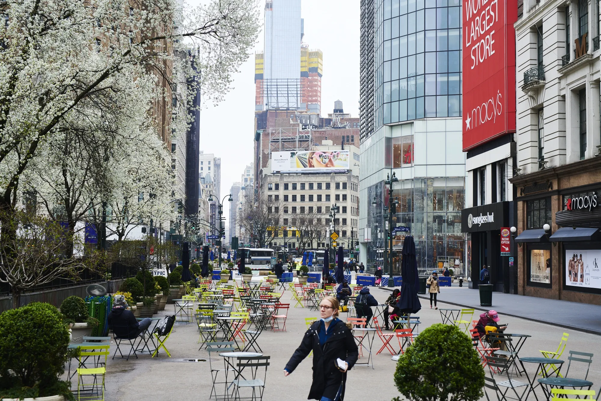 Pedestrians pass in front of a Macy's Inc. store in the Midtown neighborhood of New York on March 20.