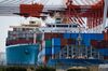 Container ships are berthed at a shipping terminal in Yokohama, Japan, on Monday, April 16, 2018. Japan and China held their first high-level economic dialogue in almost eight years on April 16 against a backdrop of trade threats from the U.S.