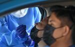 A person is tested at a drive-thru testing center in Santa Cruz, Bolivia, on Dec. 29.