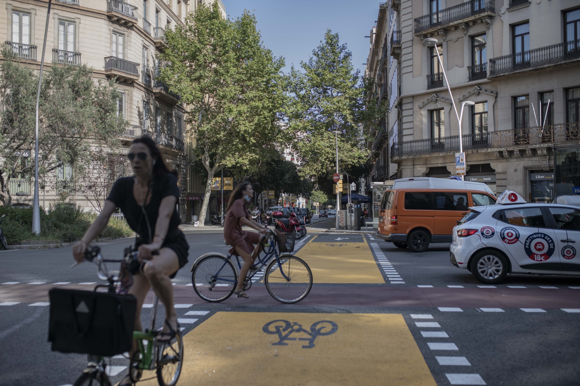 Cyclists use bike lanes&nbsp;in Barcelona, Spain. The government has identified projects to finance with green debt, such as sustainable transportation.
