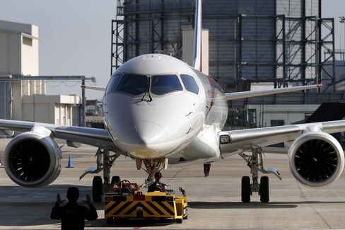 Mitsubishi Aircraft Corp. Unveils First MRJ Passenger Jet After Four-Year Delay