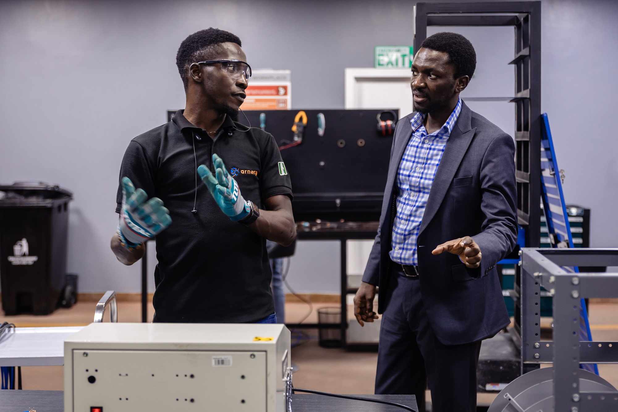 Femi Adeyemo, right, with a staff member.