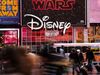NEW YORK, NY - DECEMBER 14: The Disney logo is displayed outside the Disney Store in Times Square, December 14, 2017 in New York City. The Walt Disney Company announced on Thursday morning that it had reached a deal to purchase most of the assets of 21st Century Fox. The deal has a total value of around $66 billion, with Disney assuming $13.7 billion of Fox's net debt. (Photo by Drew Angerer/Getty Images)