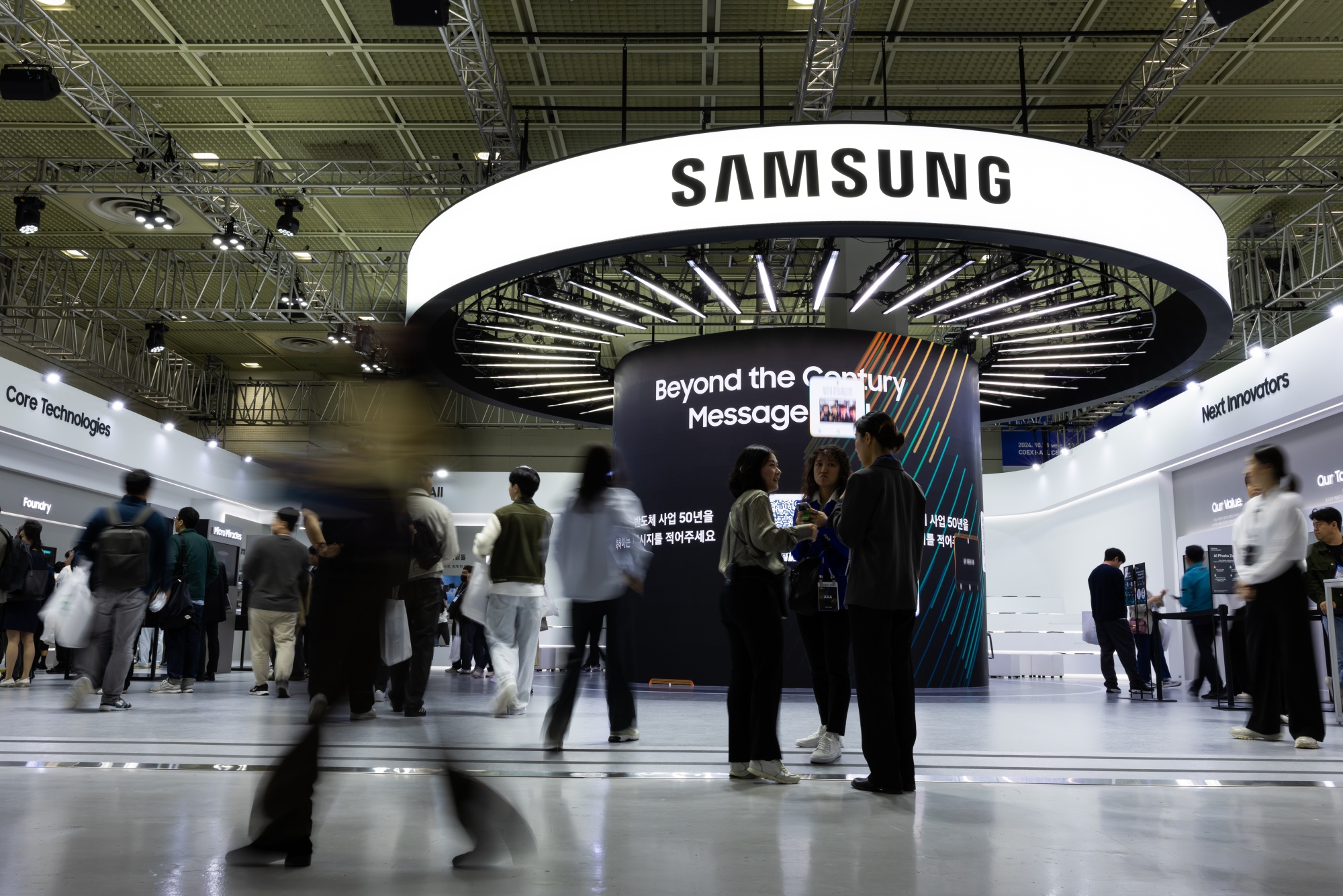 Visitors at the Samsung Electronics Co. Booth during the Semiconductor Exhibition (SEDEX) in Seoul, South Korea, on Wednesday, Oct. 23, 2024. The exhibition will continue through Oct. 24. Photographer: SeongJoon Cho/Bloomberg