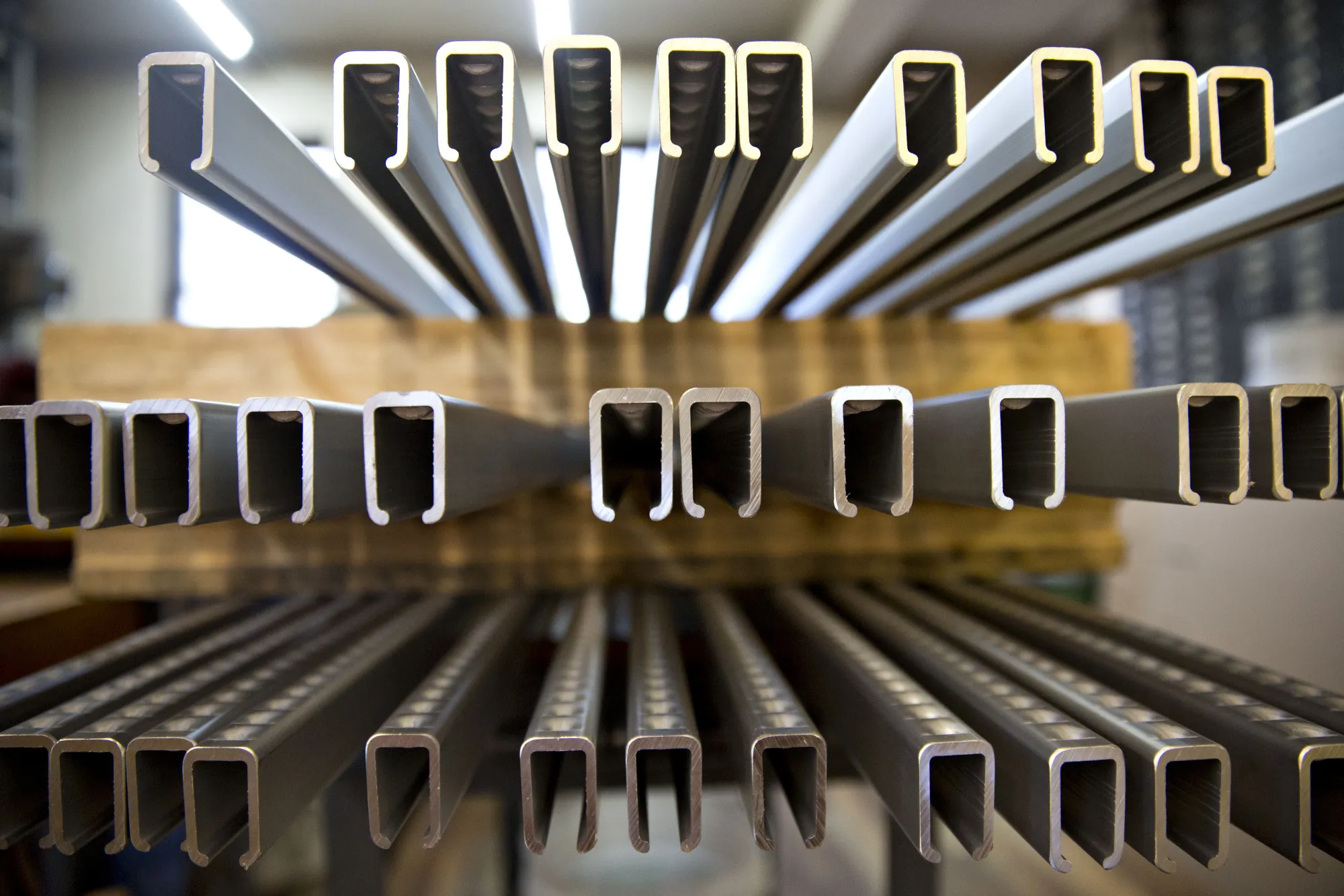 Aluminum bar clamps sit on a pallet at the Dubuque Clamp Works facility in Dubuque, Iowa U.S., on Tuesday, Aug. 8, 2017. Dubuque Clamp Works has been operating in Dubuque, Iowa, for the last four decades. Today, the company turns away new orders, partly because so much of the supply chain it relies on has moved abroad.