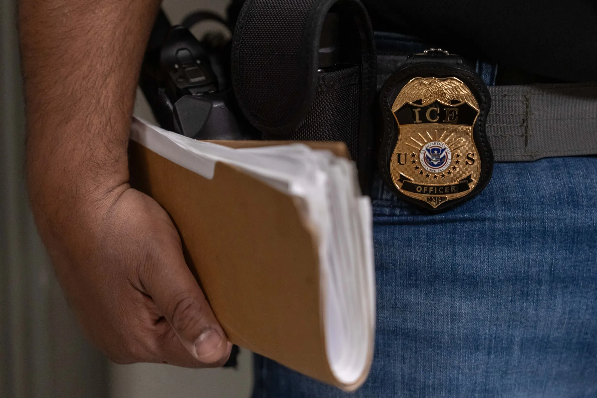 An ICE&nbsp;agent stands outside immigration court hearings&nbsp;at Jacob K. Javits Federal Building&nbsp;in New York.