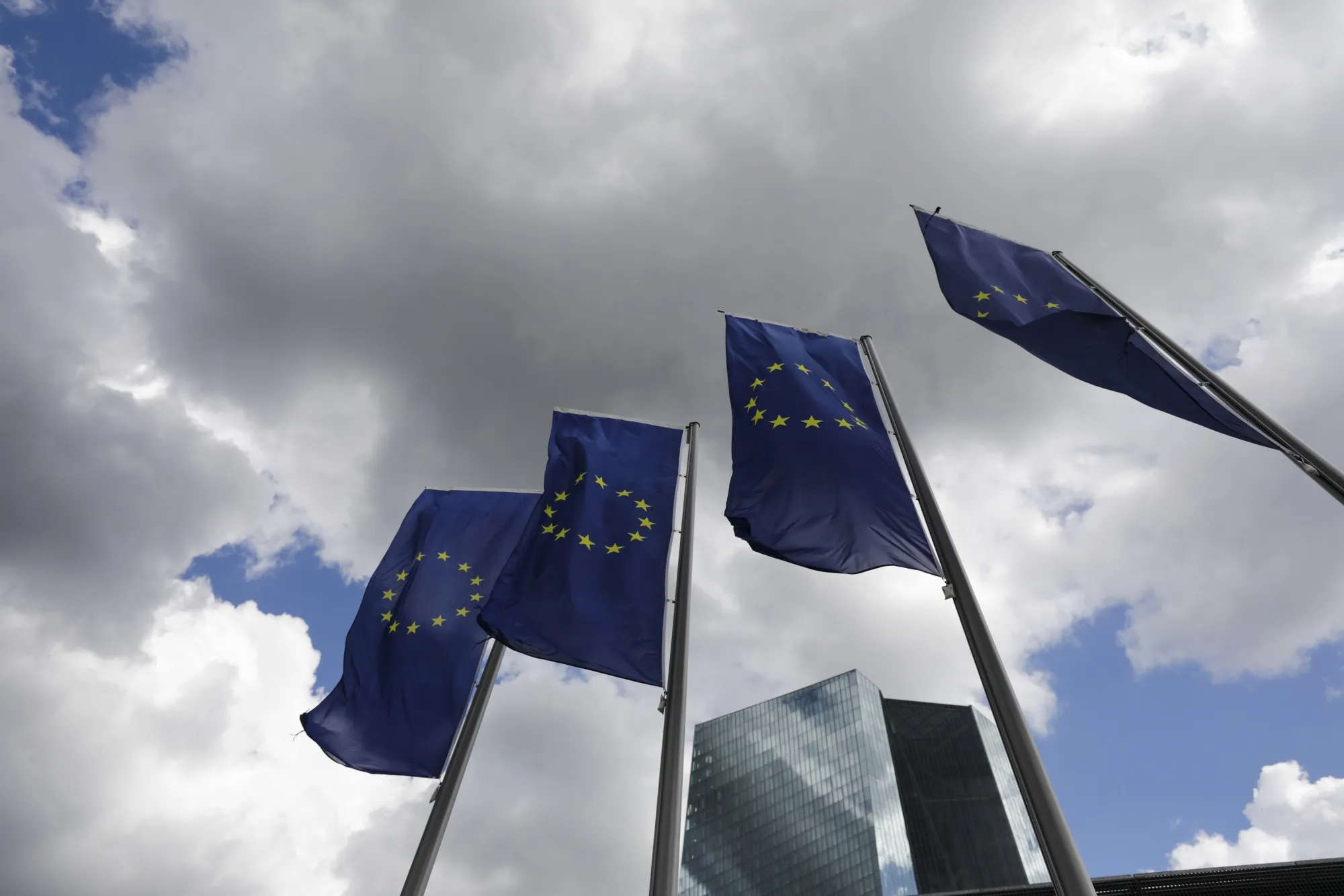 European Union flags fly outside the European Central Bank&nbsp;headquarters in Frankfurt.