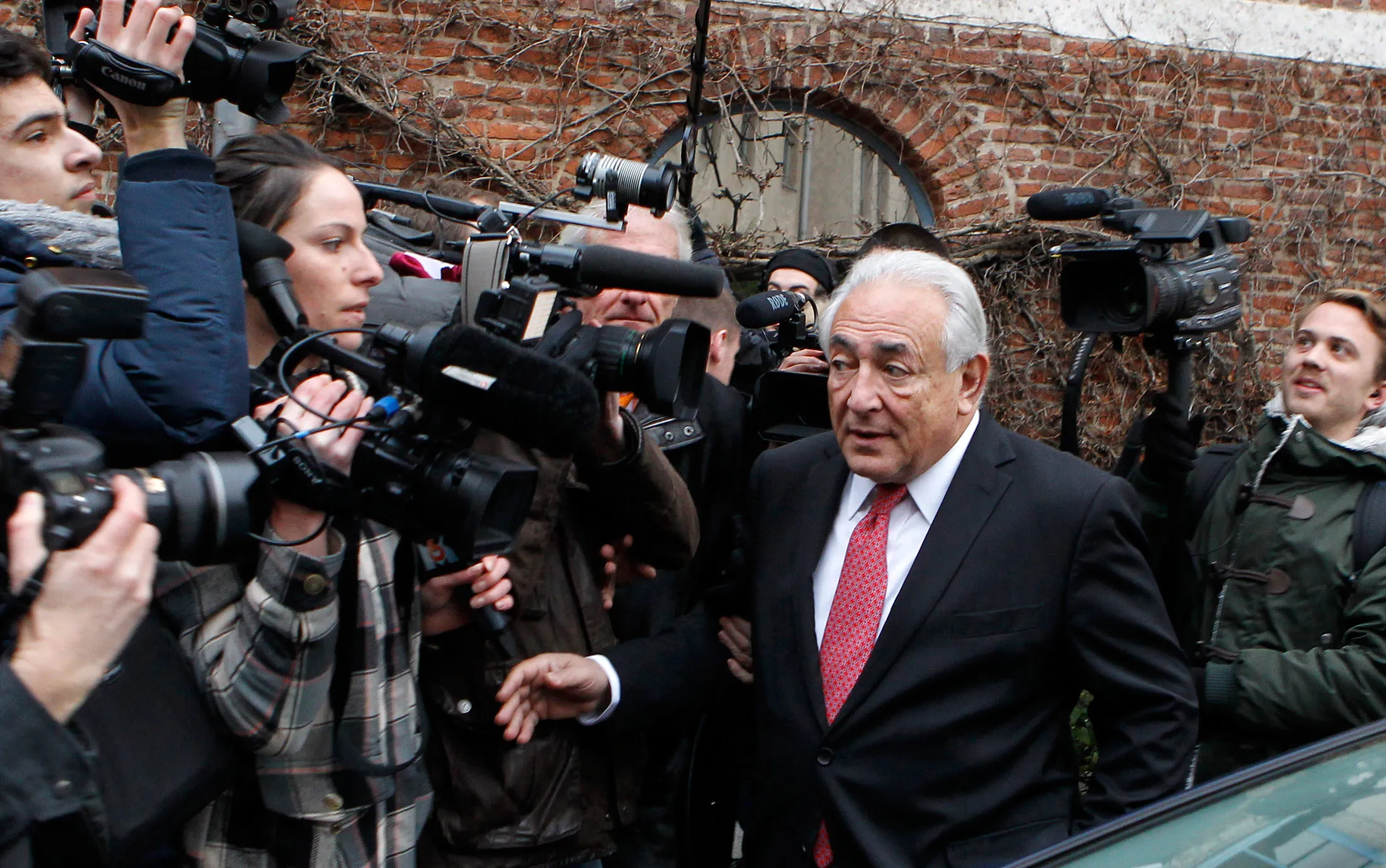 Former IMF head Dominique Strauss-Kahn leaves his hotel in Lille, northern France, on Feb. 12, 2015.
