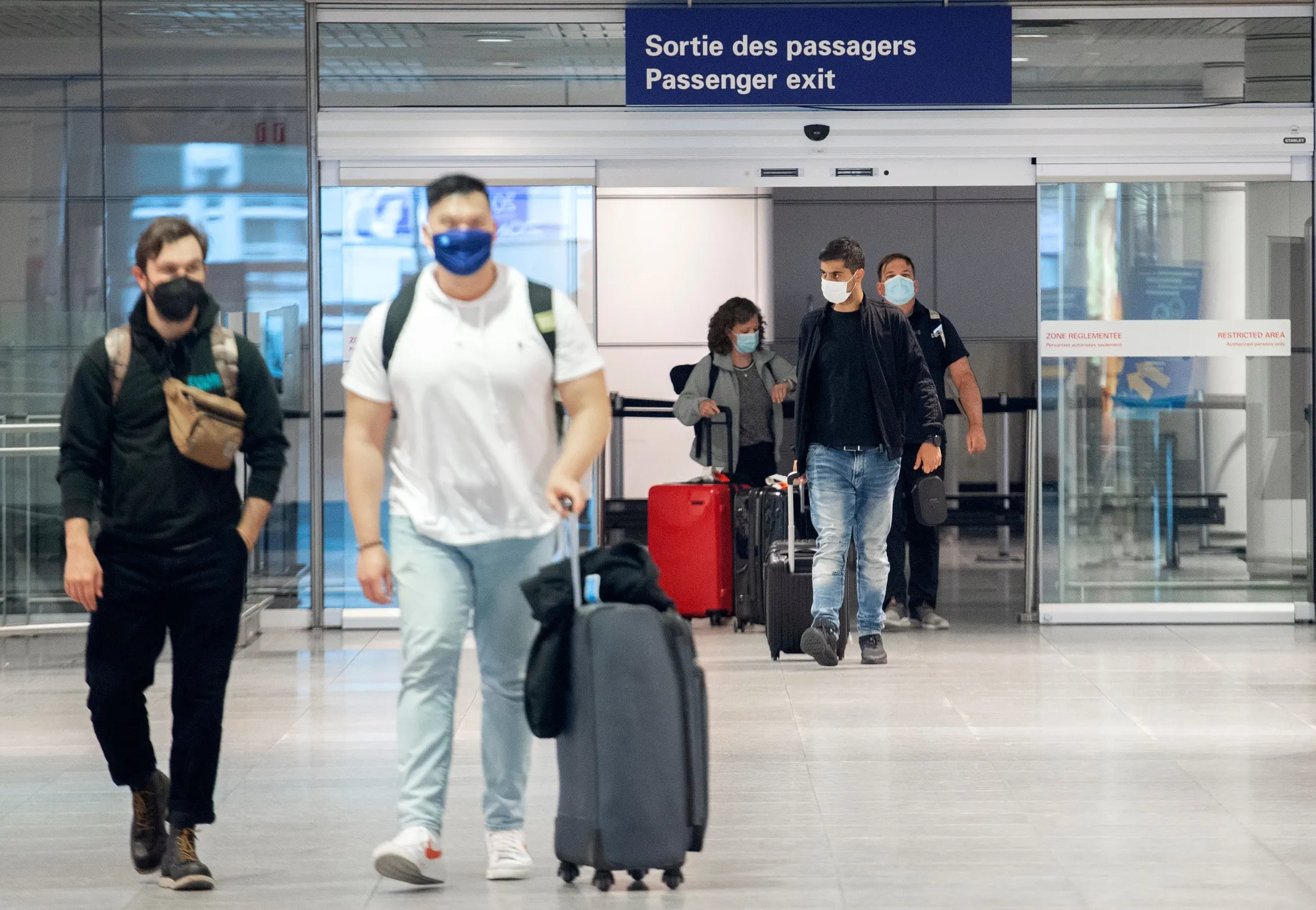 Travelers arrive at Montreal’s international in April.