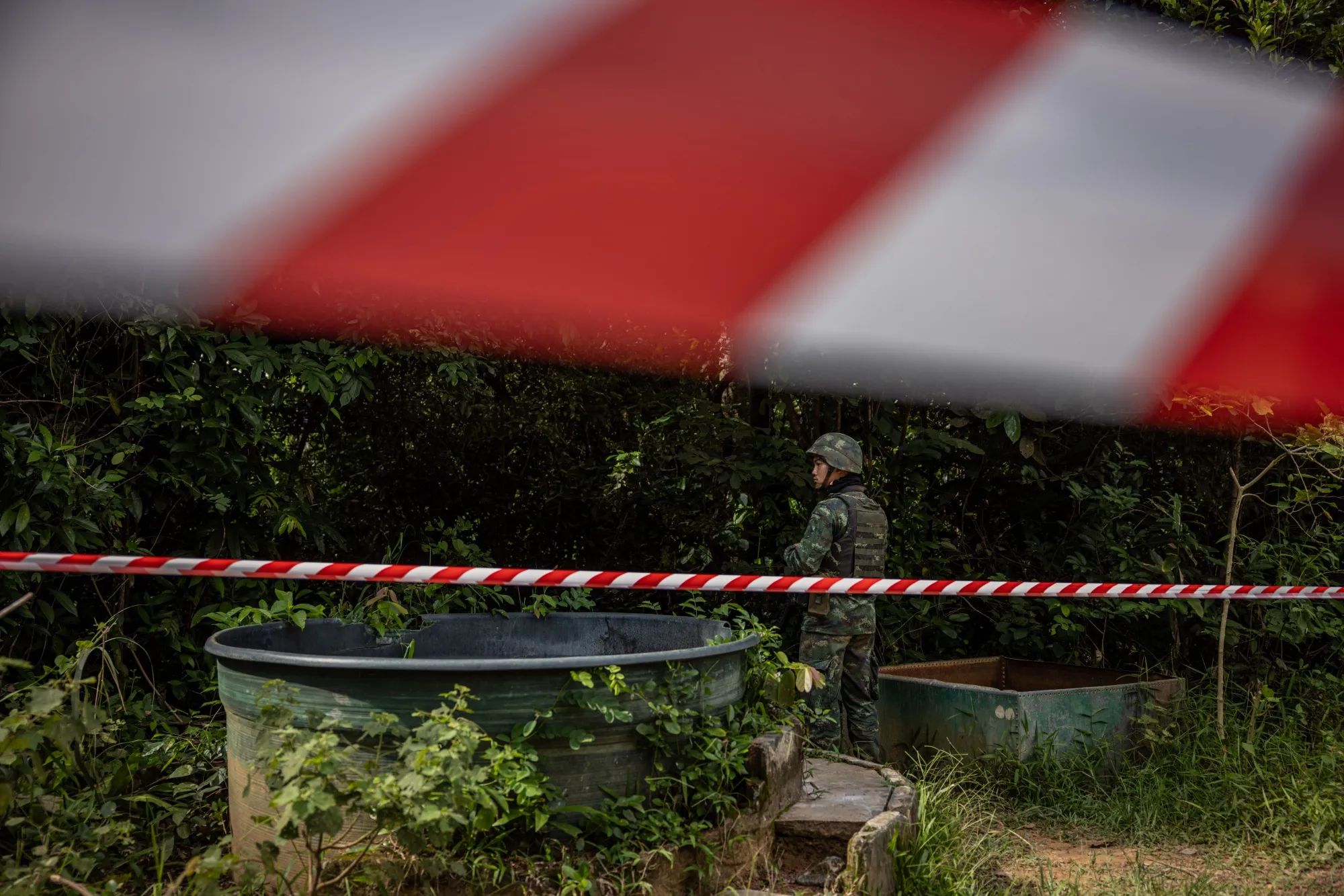 A soldier stands guard during landmine clearance operations in Si Sa Ket province, Thailand, in August.