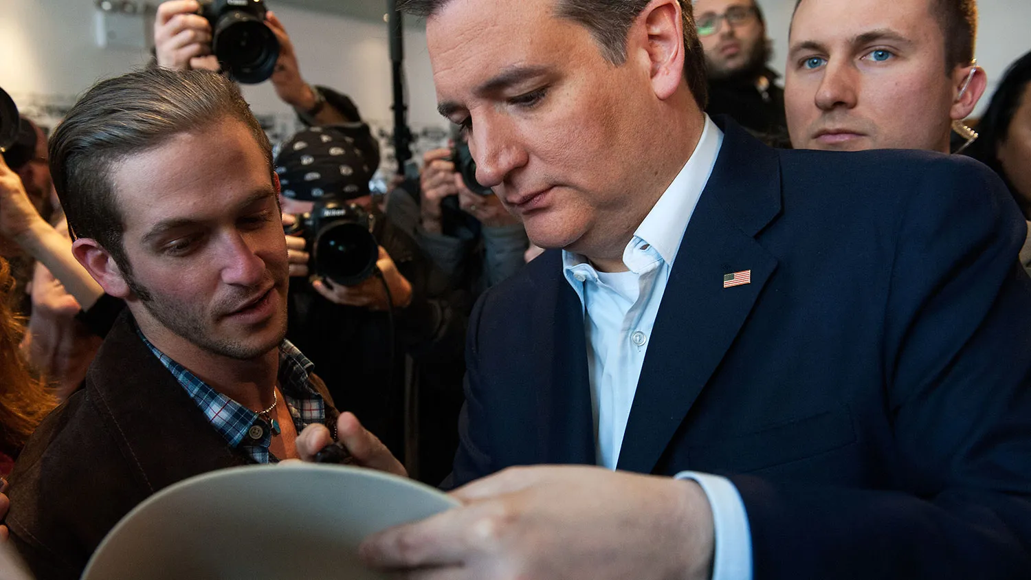 Lazer Axelman (left) has Republican presidential candidate Ted Cruz autograph his cowboy hat on April 6, 2016, in the Bronx.
