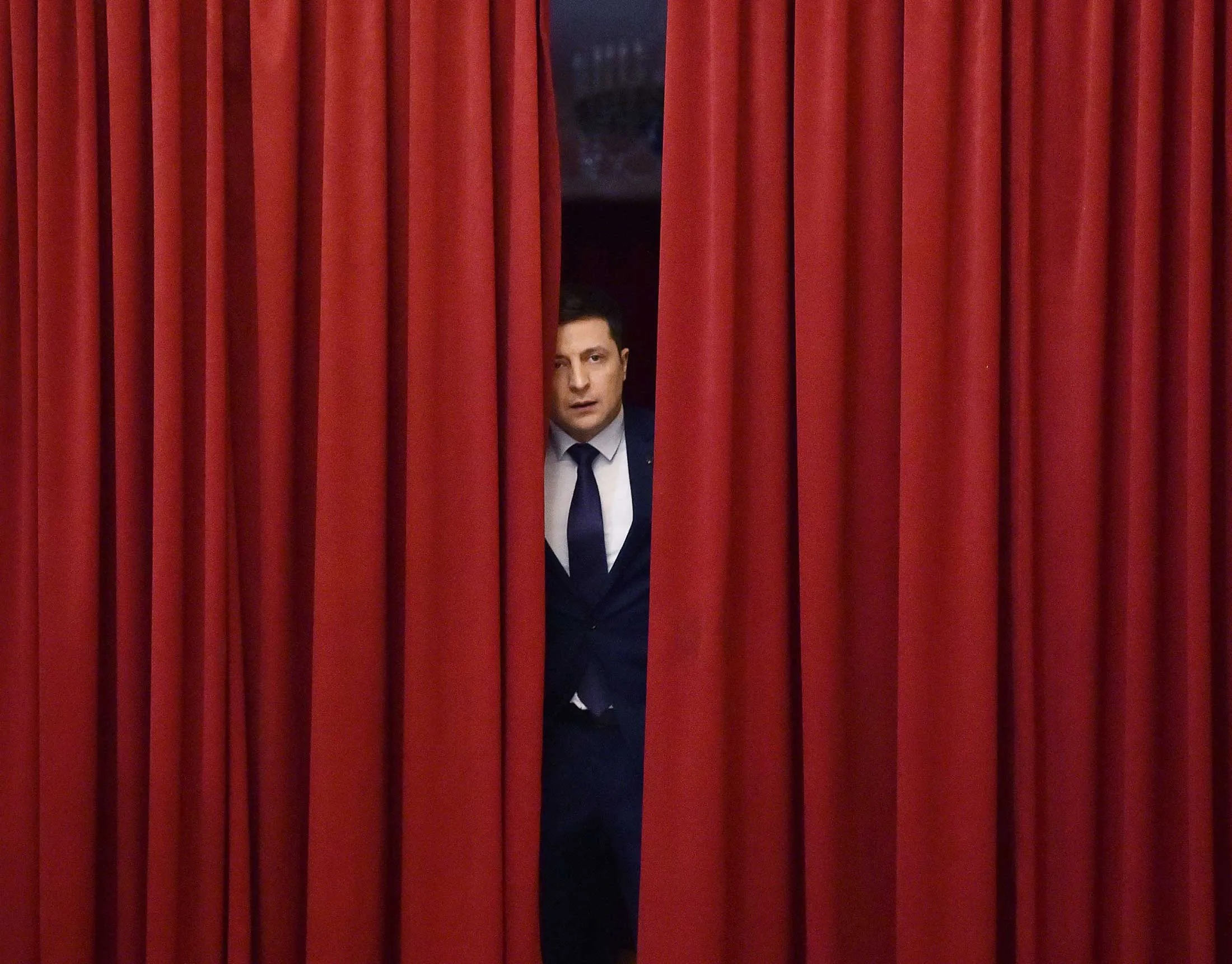 Ukrainian comic actor and presidential candidate Volodymyr Zelenskiy enters a hall in Kiev on March 6, 2019, to take part in the shooting of the television series Servant of the People, where he plays the role of president of Ukraine.