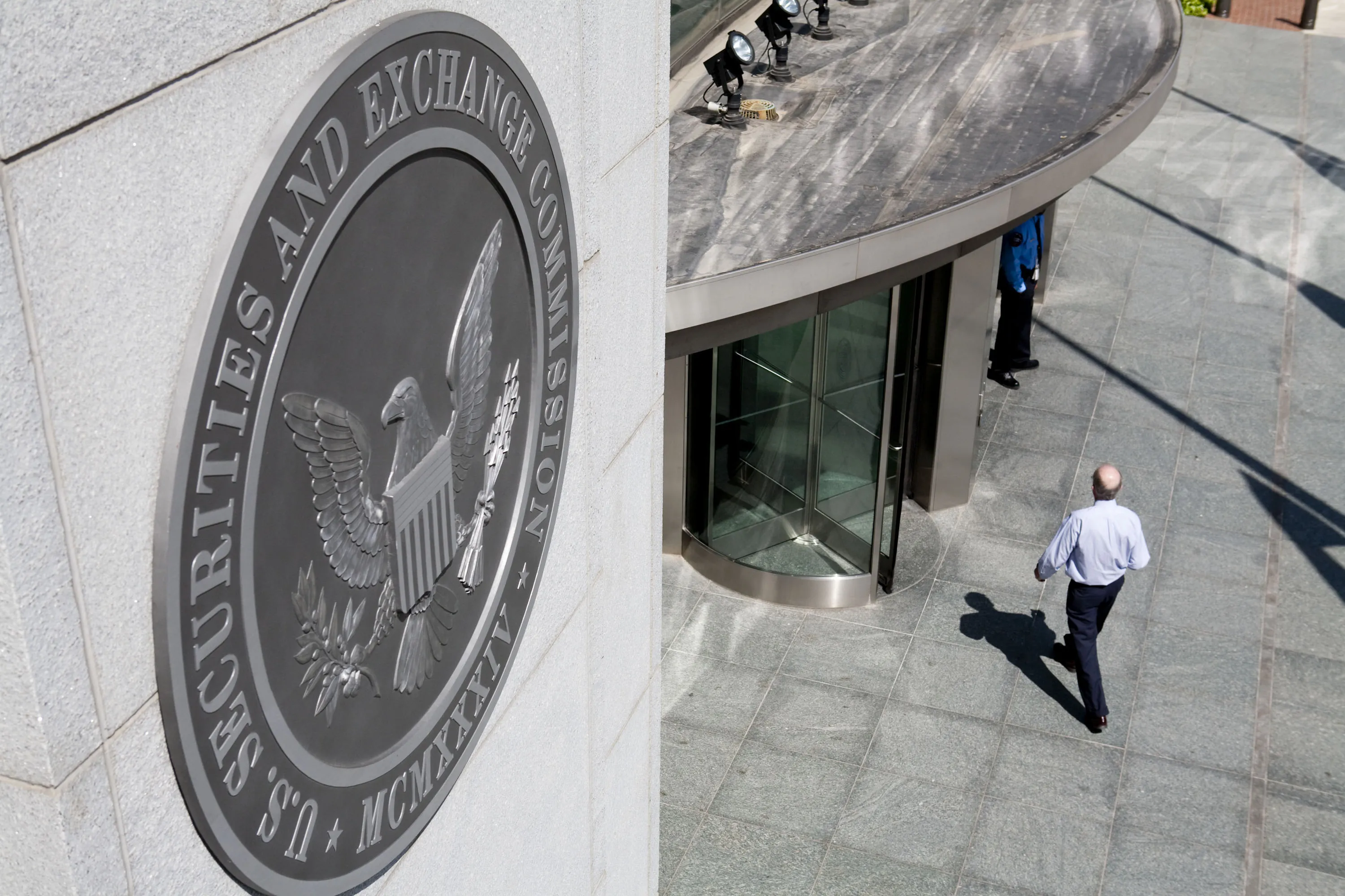 A person walks into the headquarters of the U.S. Securities and Exchange Commission&nbsp;in Washington, D.C.