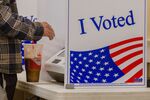 A voter casts a ballot using a cotton swab at a polling location for the 2020 Presidential election in Seneca, South Carolina, U.S., on Tuesday, Nov. 3, 2020.