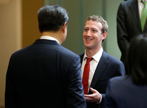 Chinese President Xi Jinping, left, talks with Facebook Chief Executive Mark Zuckerberg, right, during a gathering of CEOs and other executives at Microsoft's main campus September 23, 2015 in Redmond, Washington.