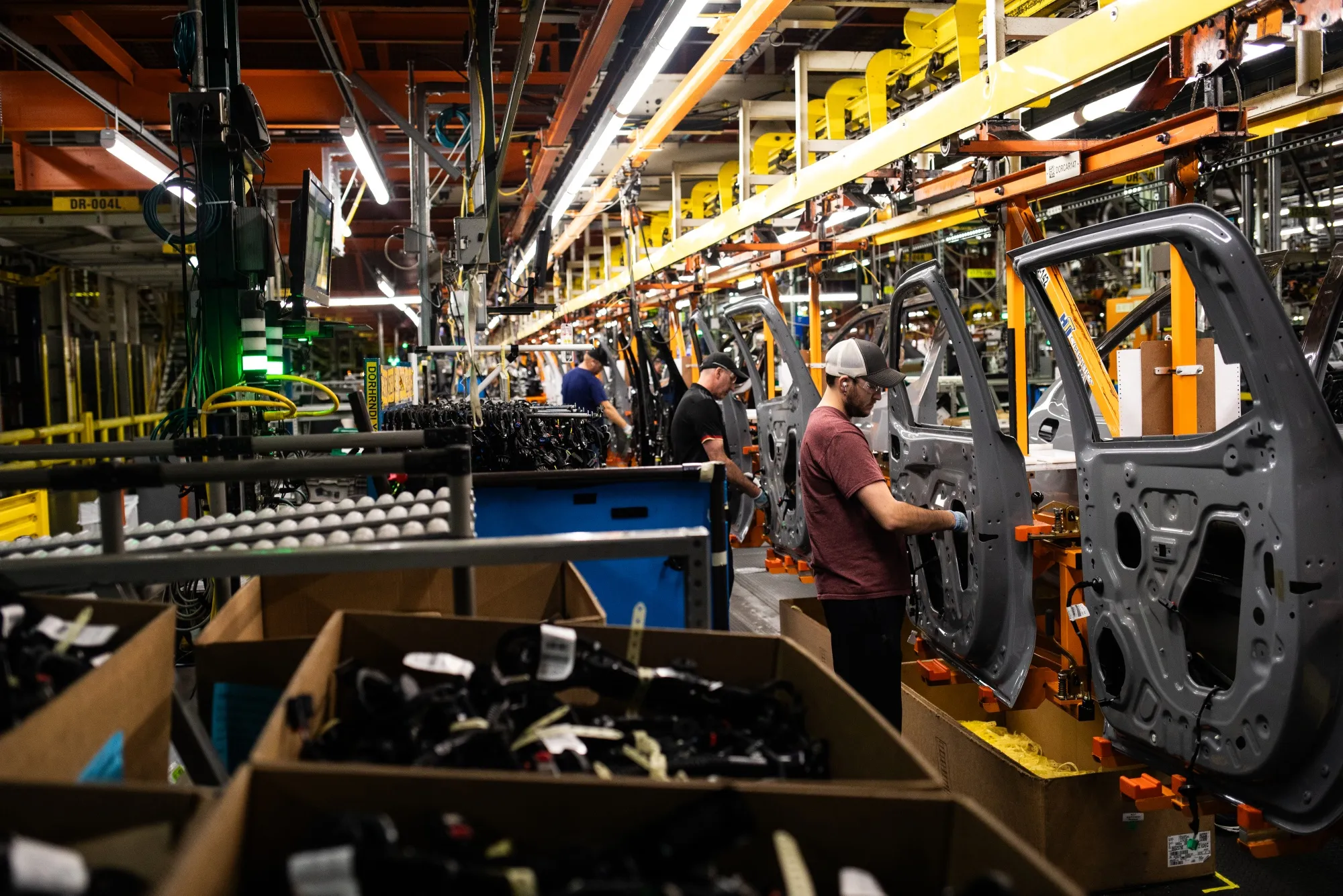 Workers assemble vehicle doors at an&nbsp;assembly plant in Fort Wayne, Indiana.&nbsp;Auto parts represent about half of the value of auto industry imports into the US.