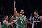 Boston Celtics forward Jayson Tatum (0) celebrates after a basket against the Milwaukee Bucks in the first half of Game 2 of an Eastern Conference semifinal in the NBA basketball playoffs Tuesday, May 3, 2022, in Boston. (AP Photo/Charles Krupa)