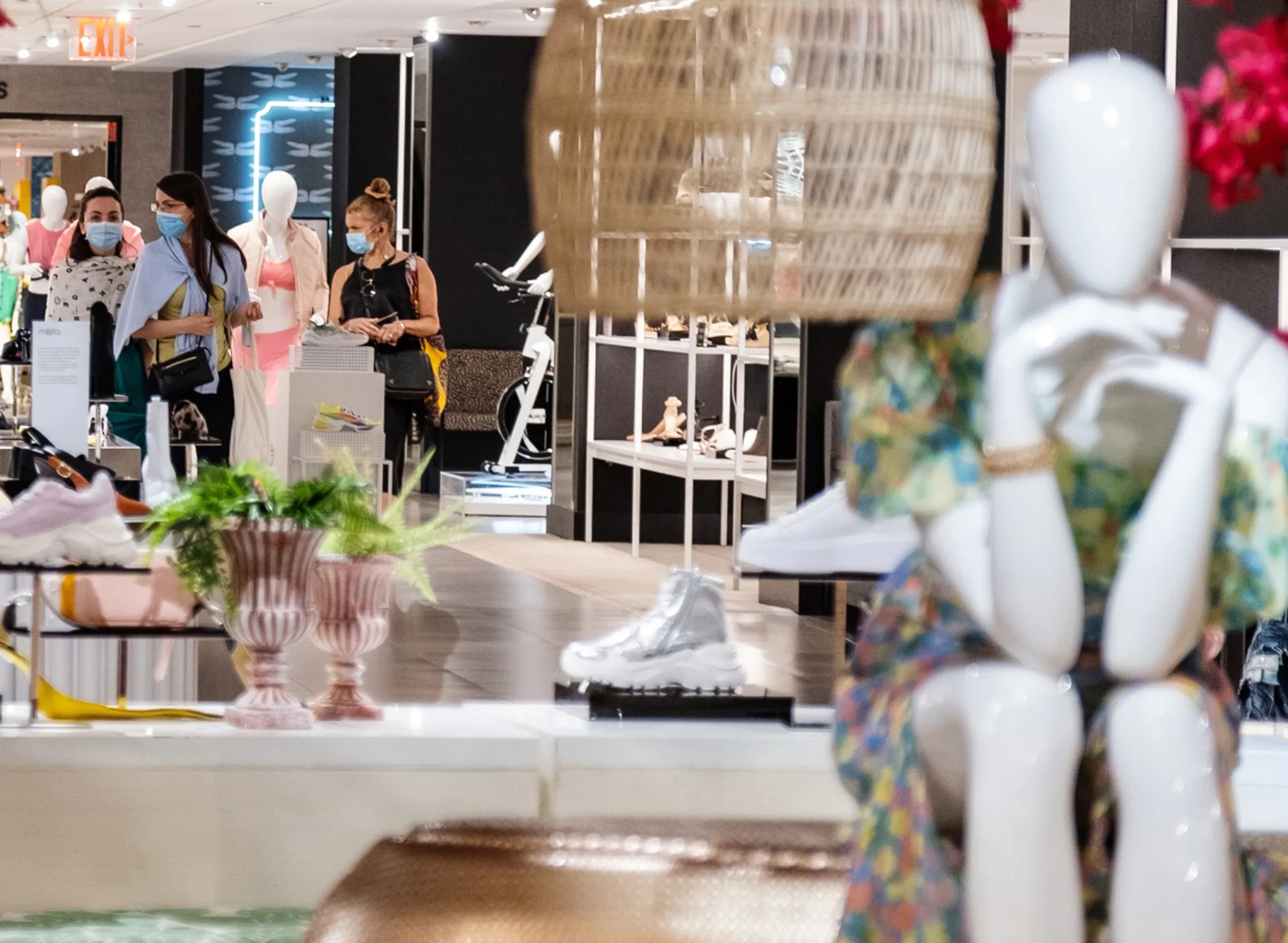 Shoppers browse the shoe department at a store in New York on June 22.