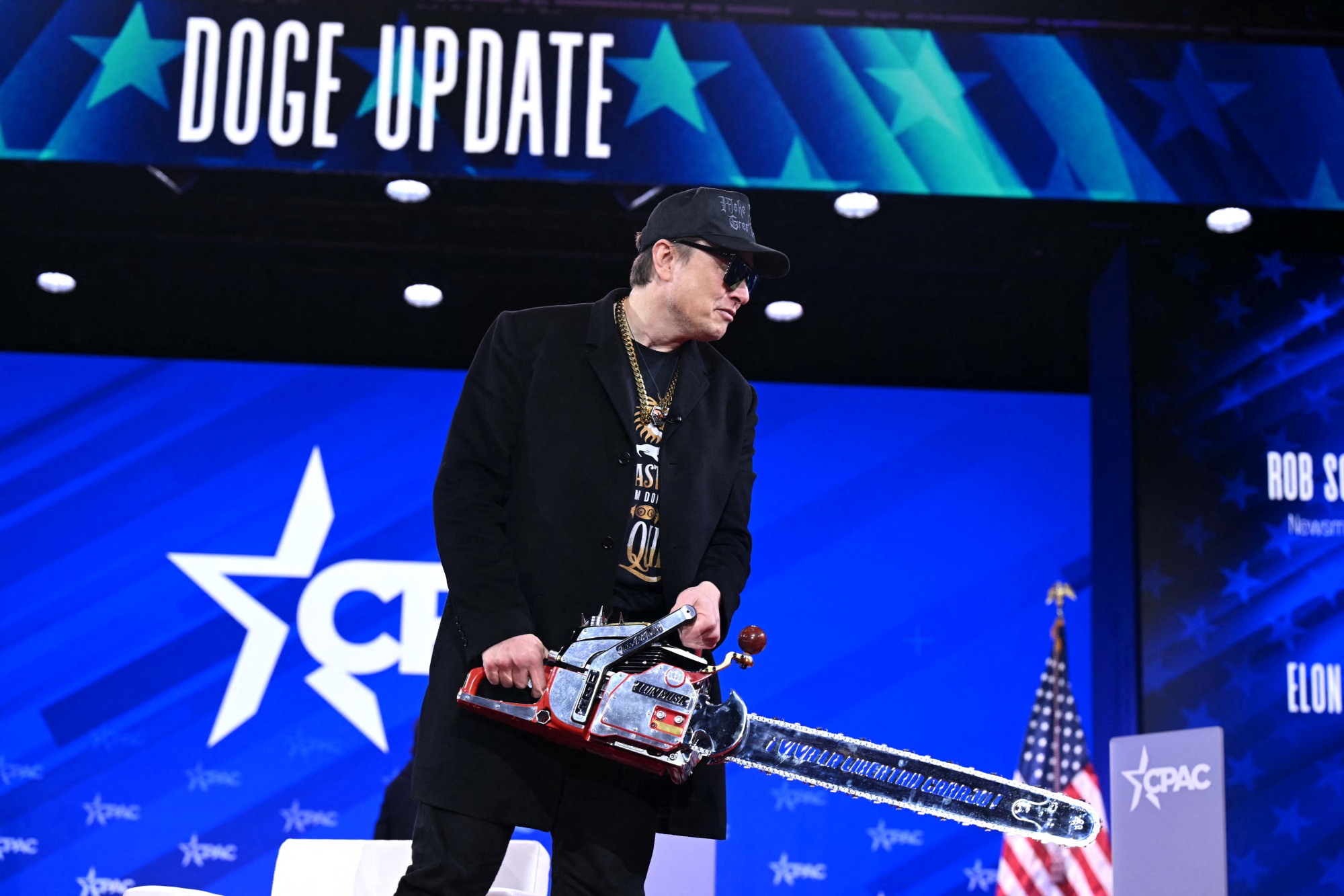 Elon Musk holds a chainsaw reading "Long live freedom, damn it" during the annual Conservative Political Action Conference (CPAC) at the Gaylord National Resort &amp;amp; Convention Center at National Harbor in Oxon Hill, Maryland, on February 20, 2025. The chainsaw was a present to Elon Musk from Argentina's President Javier Milei. (Photo by SAUL LOEB / AFP) (Photo by SAUL LOEB/AFP via Getty Images) Photographer: SAUL LOEB/AFP