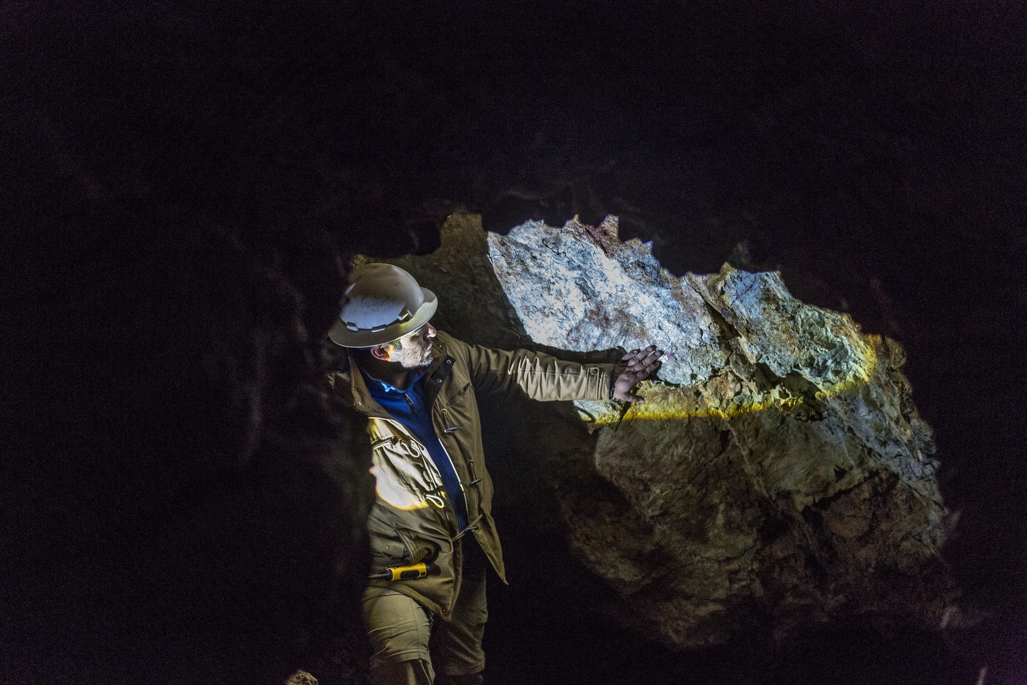 A miner inspects the inside of a cobalt mine in La Cobaltera, Atacama Region, Chile.