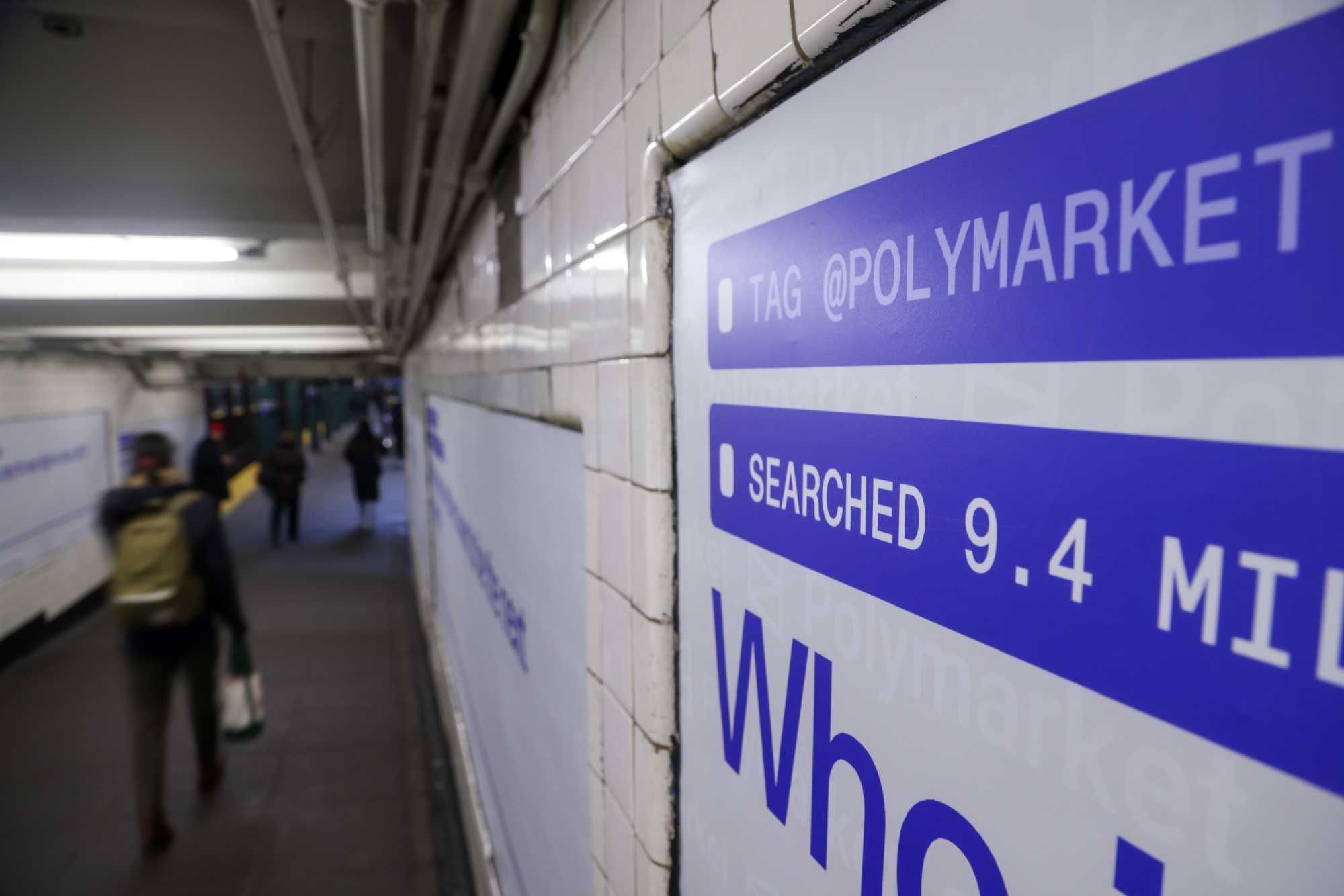 A Polymarket advertisement in a subway station in New York, US, on Thursday, Feb. 5, 2026. Kalshi and Polymarket, which have been assailed by critics for encouraging financial risk taking by making betting more accessible, are now using the promise of free groceries to win over New Yorkers. Photographer: Michael Nagle/Bloomberg