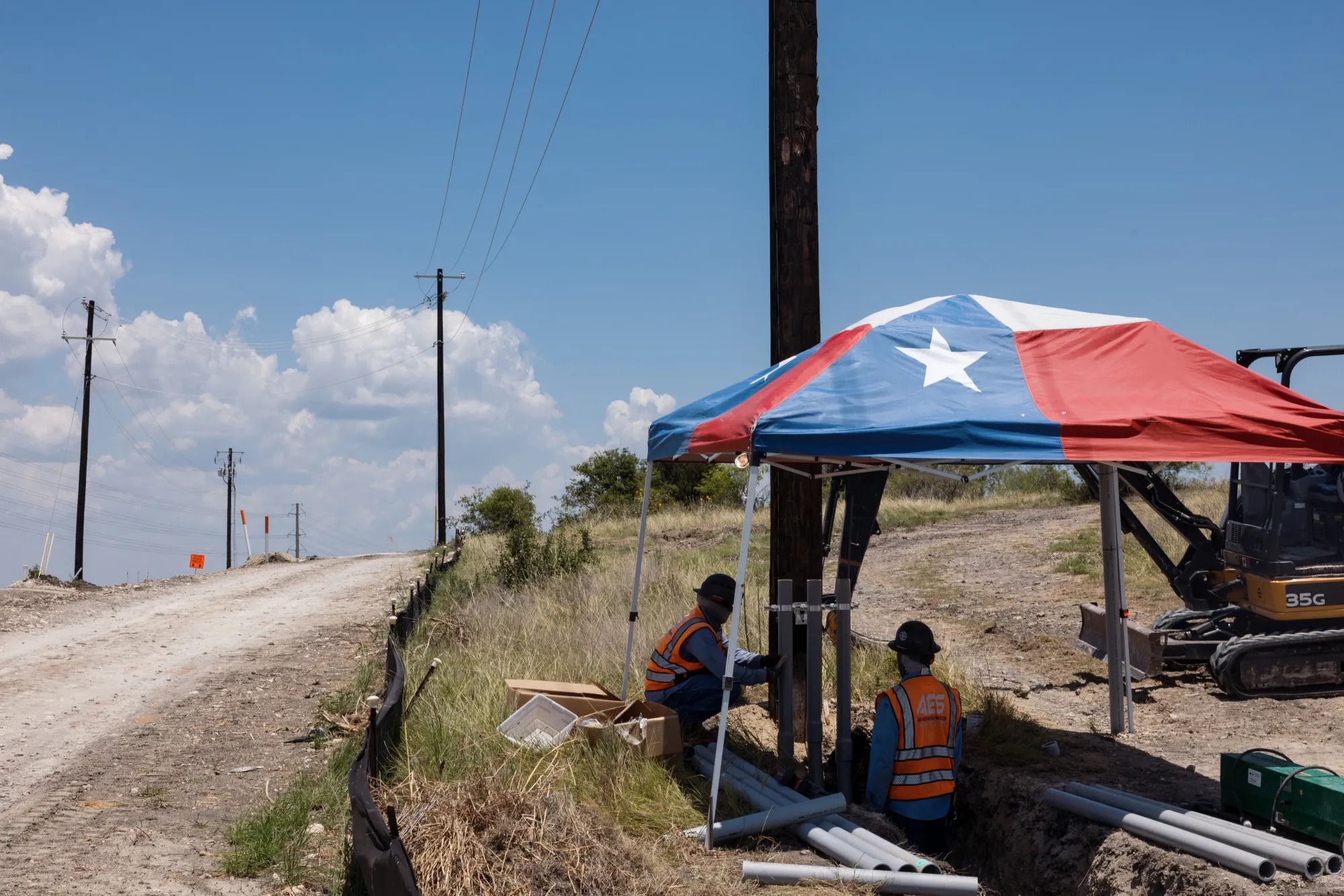 Workers install infrastructure under a&nbsp;tent during a heatwave in Austin, Texas on July 11.