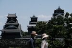 Visitors outside the Kumamoto Castle in Kumamoto.