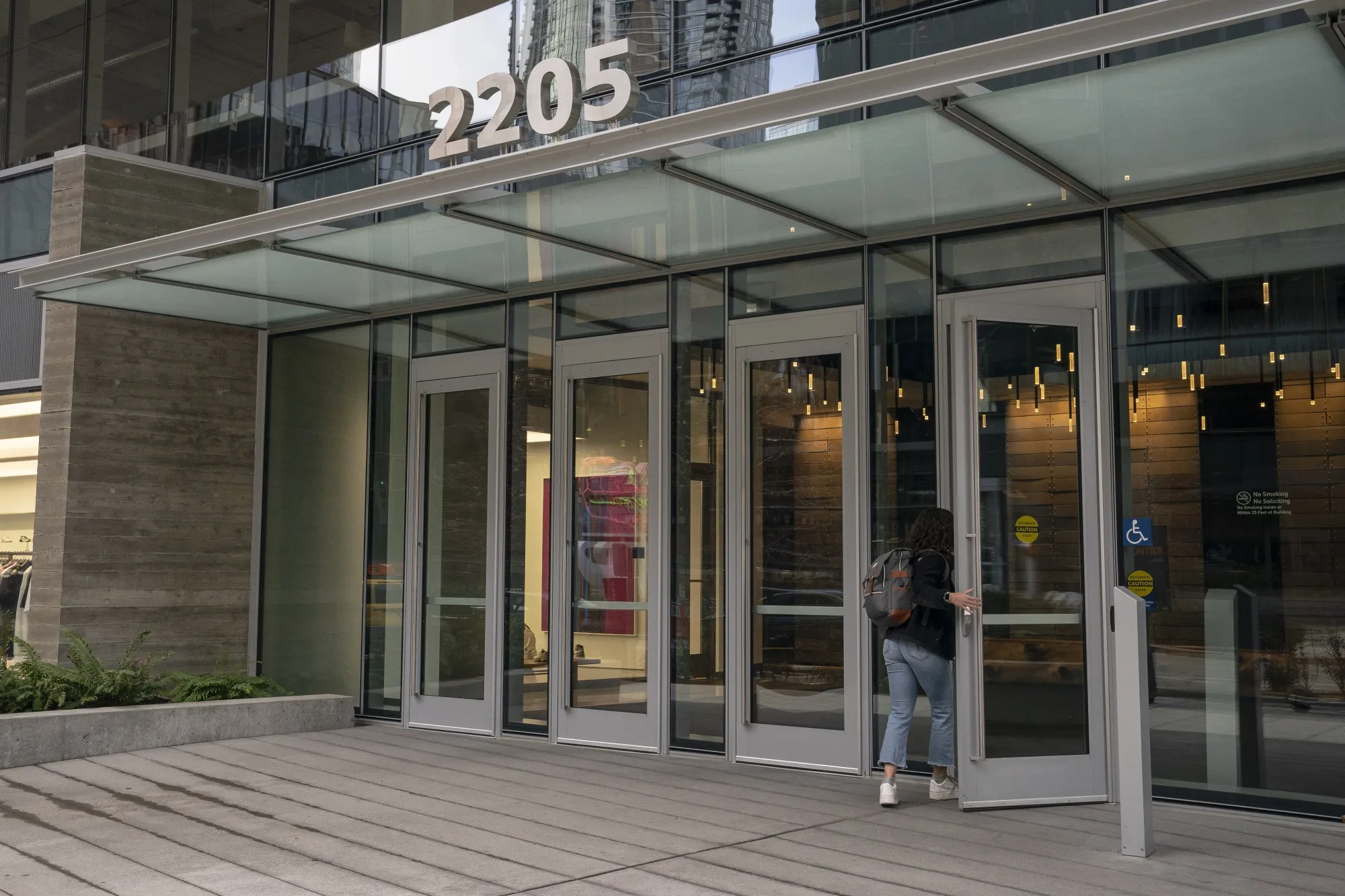 A worker enters the Amazon headquarters campus in the South Lake Union neighborhood of Seattle, Washington.