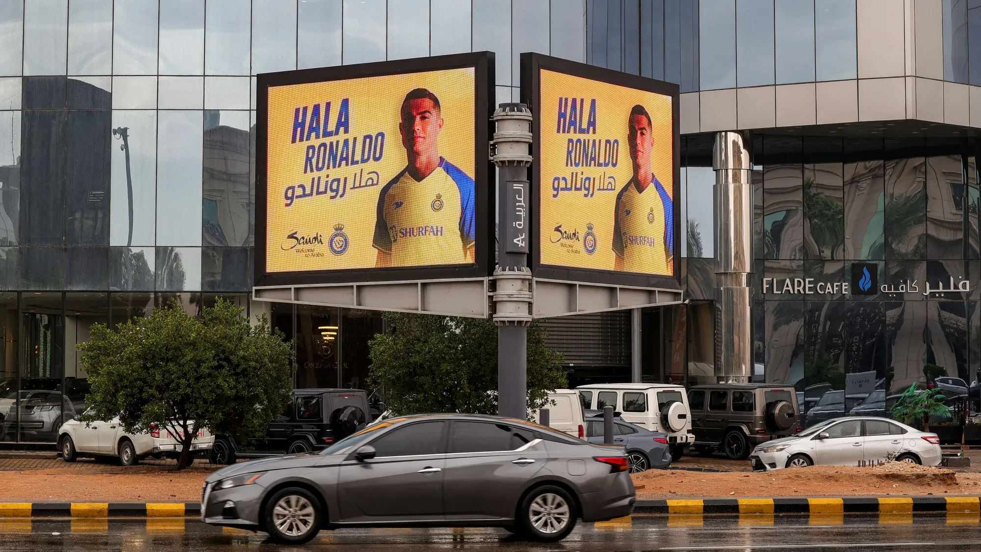 A vehicle drives past a billboard welcoming Christiano Ronaldo to&nbsp;&nbsp;Saudi Pro League team, al-Nassr, in Riyadh, Saudi Arabia.