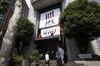 Pedestrians walk past the Tokyo Stock Exchange (TSE), operated by Japan Exchange Group Inc. (JPX), in Tokyo, Japan, on Wednesday, Aug. 30, 2017. Equity indexes in Japan, Hong Kong and South Korea rose Wednesday after U.S. stocks rebounded from losses initially sparked when Kim's regime fired a missile over Japan.