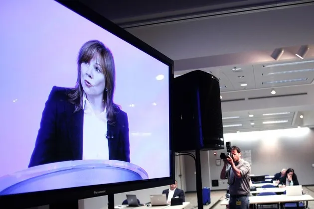 General Motors CEO Mary Barra is shown on a screen in the press room speaking to employees on June 5 in Warren, Michigan