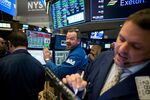 Traders work on the floor of the New York Stock Exchange (NYSE) in New York, U.S.
