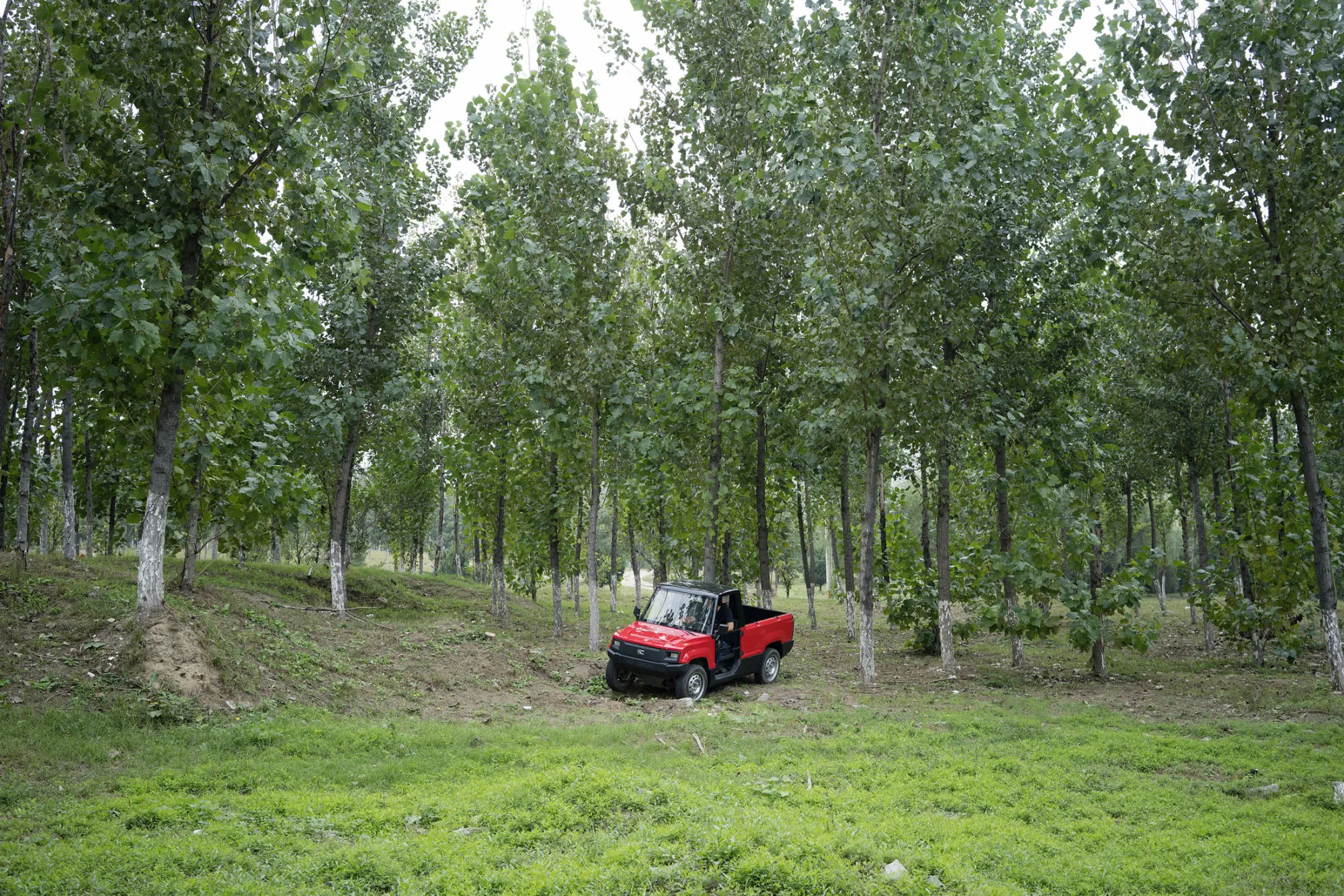 Kaiyun Motors founder Wang Chao drives the Pickman truck, which is 3.2 meters long and 1.3-meters wide and weighs just 680 kilograms.
