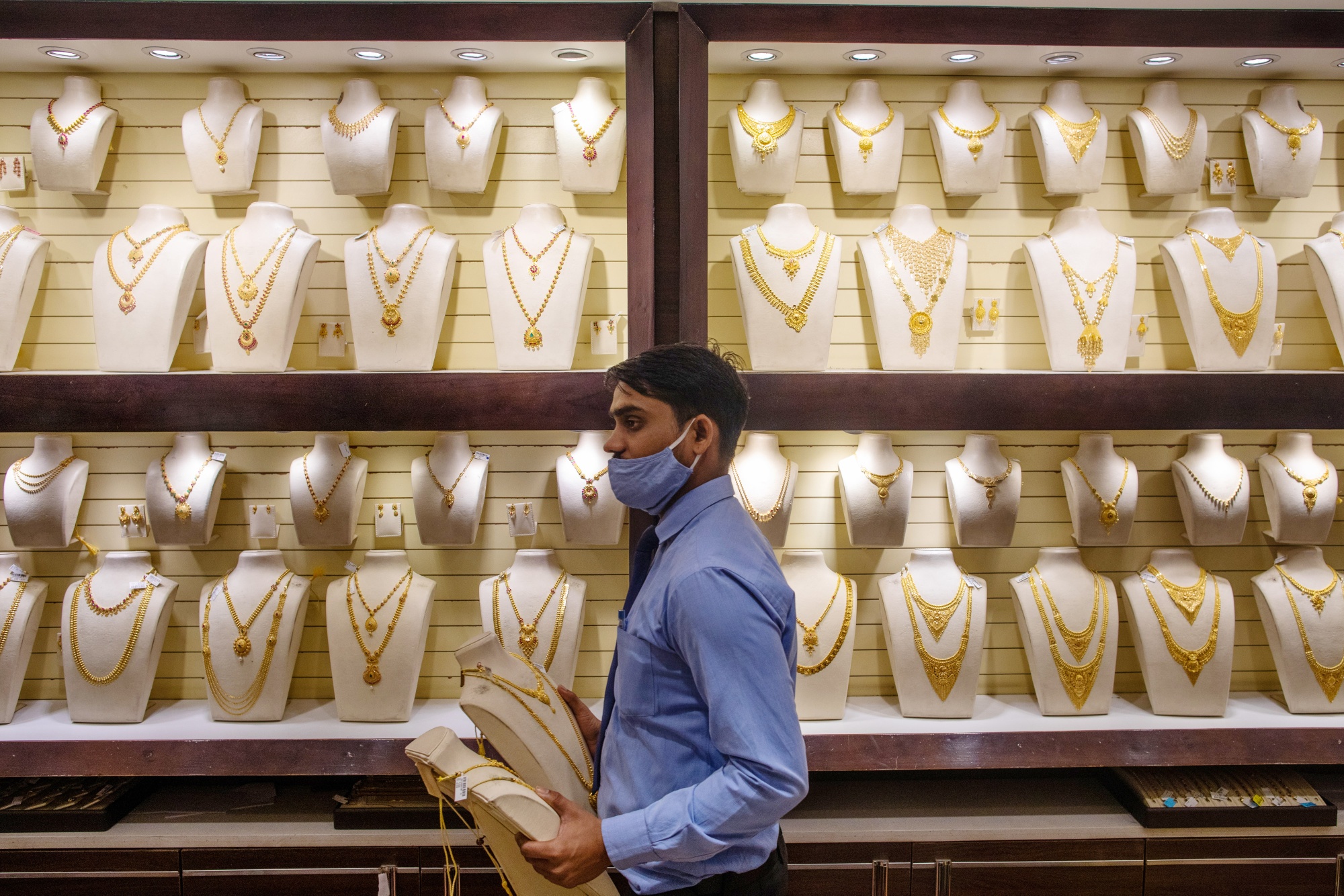 Gold necklaces inside a store in Noida, India.