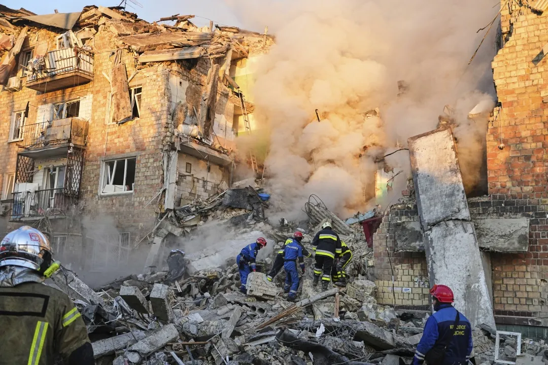 Firefighters work at the site of a Russian attack in Kyiv, on Aug. 28.