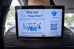 The TraceTogether contact-tracing app in a taxi in Singapore.&nbsp;The new law allows access to contact tracing data under seven categories of serious crime including murder, rape and drug trafficking.&nbsp;