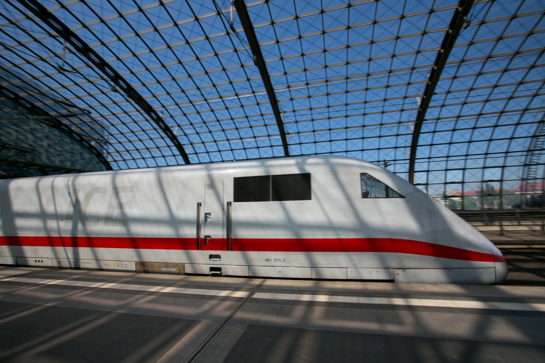 A Deutsche Bahn AG InterCity Express (ICE) train, manufactured by Siemens AG, leaves Berlin Central Station in Berlin.