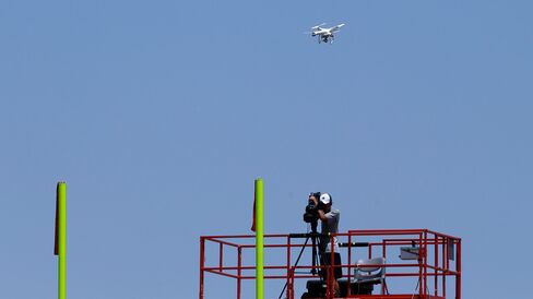 A drone hovers over the practice field during a Dallas Cowboys organized team activity at the NFL football team's headquarters on June 10, 2015, in Irving, Texas.