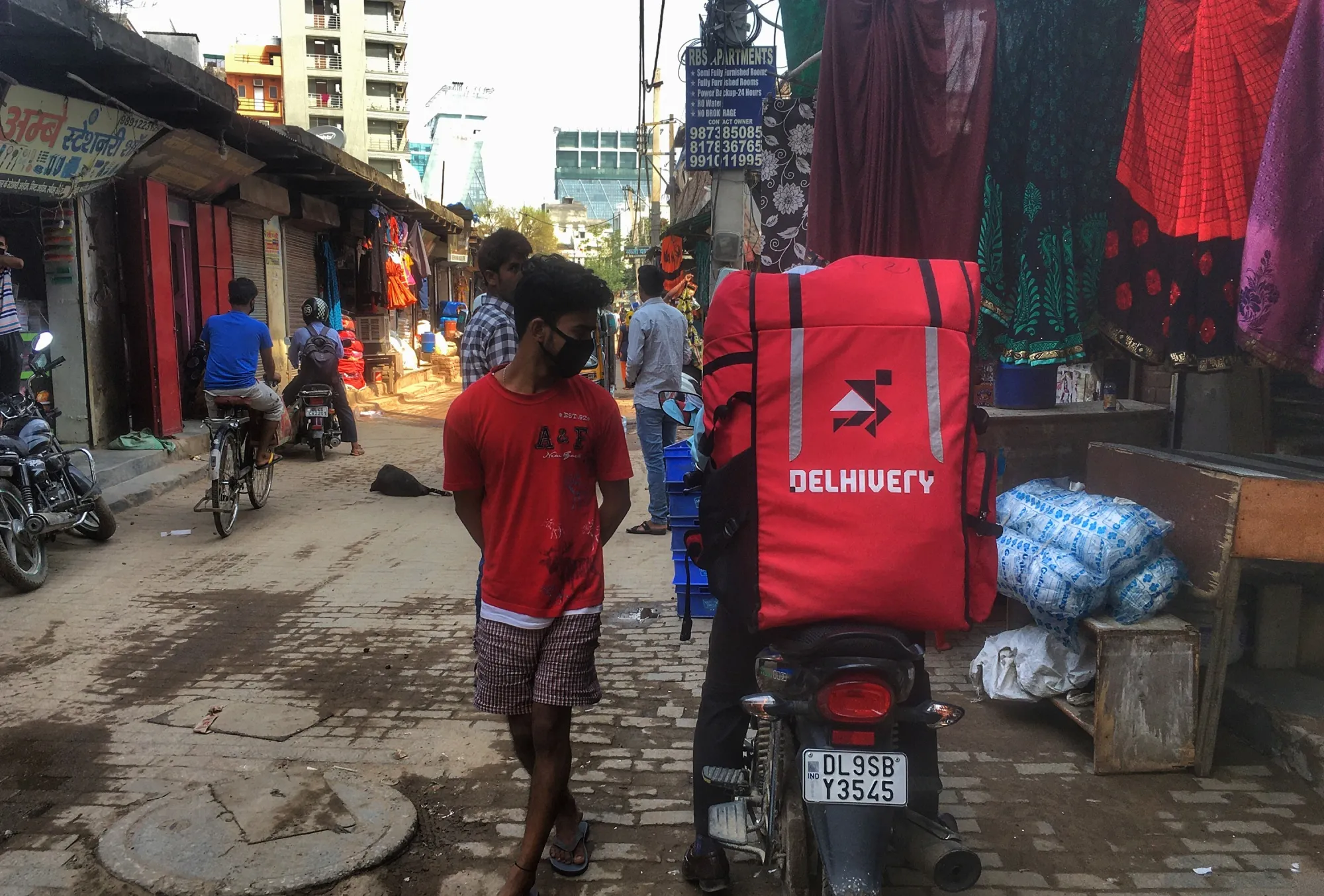 A delhivery driver in Gurugram on the outskirts of New Delhi, India.&nbsp;