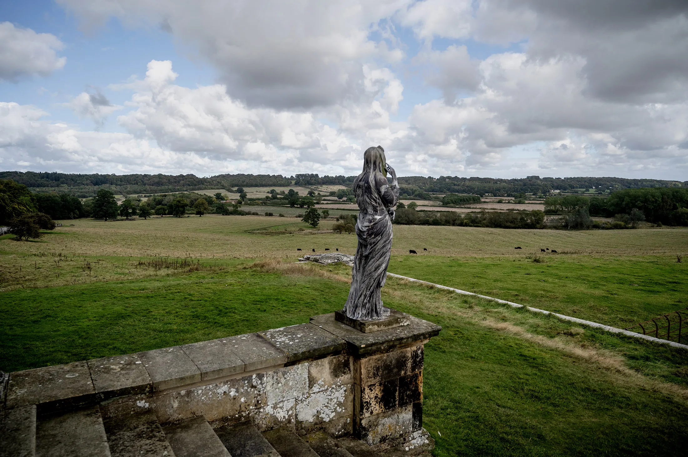 A statue at the Temple of the Four Winds on the Castle Howard estate in Yorkshire, UK, looks out on farmland that will be restored to promote biodiversity.&nbsp;
