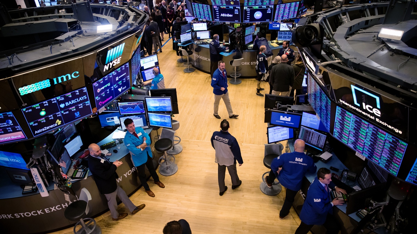 Traders work on the floor of the New York Stock Exchange.